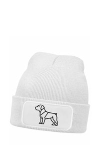 White knitted beanie with a ribbed texture featuring a black outline of a dog on a rectangular white patch. Soft, flexible fabric.