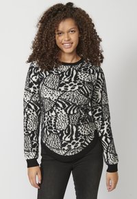 Czarny i biały sweter w wzory z abstrakcyjnymi motywami, z długimi rękawami, okrągłym dekoltem i miękkim, teksturowanym wykończeniem.
