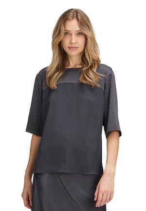 Dark gray short-sleeve blouse with a square neckline and smooth, lightweight fabric. Features a relaxed fit and subtle stitching detail.