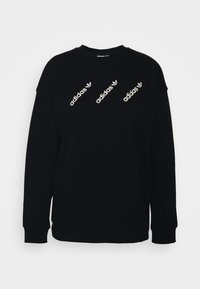 Black sweatshirt made of cotton blend, featuring three diagonal white Adidas logos. Simple crew neck and ribbed cuffs and hem.