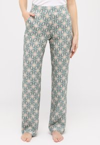 Gemusterte weite Hosen aus leichtem Stoff, mit einem geometrischen Design in Grün, Beige und Gelb, seitlichen Taschen und einem glatten Bund.