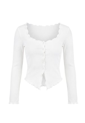 Witte geribbelde cropped cardigan met lange mouwen, geschulpte randen en kleine knoopjes aan de voorkant.
