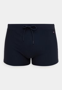 Μπλε ναυτικό μαγιό σορτς από ελαστικό υλικό με κορδόνι στη μέση και μικρό λογότυπο στο κάτω μέρος.