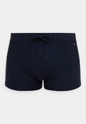 Μπλε ναυτικό μαγιό σορτς από ελαστικό υλικό με κορδόνι στη μέση και μικρό λογότυπο στο κάτω μέρος.