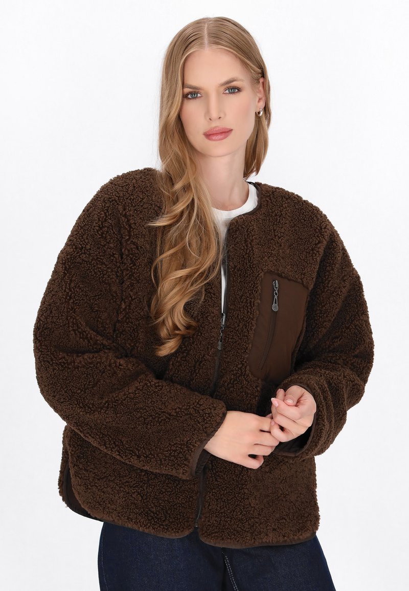 Brown fleece jacket with a zippered chest pocket, textured fabric, and ribbed cuffs. Features a relaxed fit and slightly cropped length.