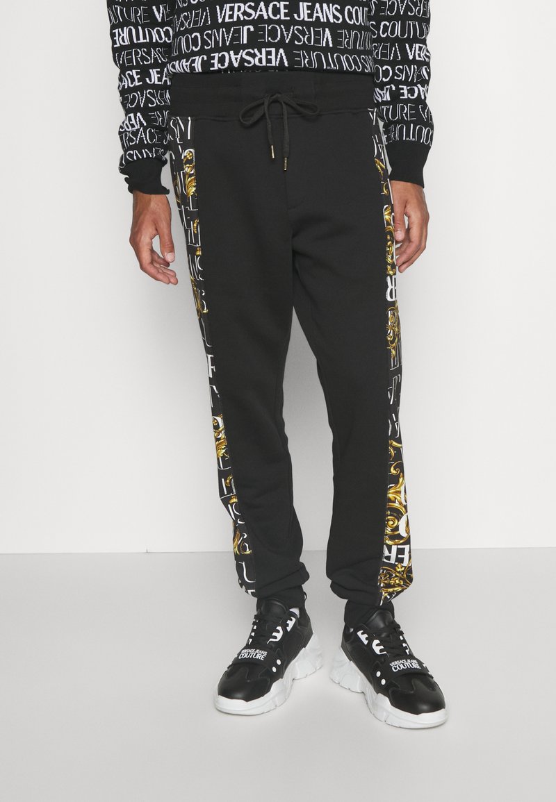 pantalone versace