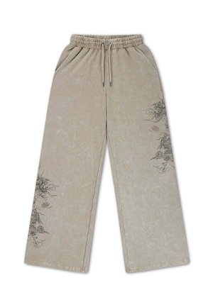 Pantaloni beige a gamba larga con vita elastica e coulisse, con elaborati disegni di draghi neri sulla coscia sinistra e sul polpaccio destro.