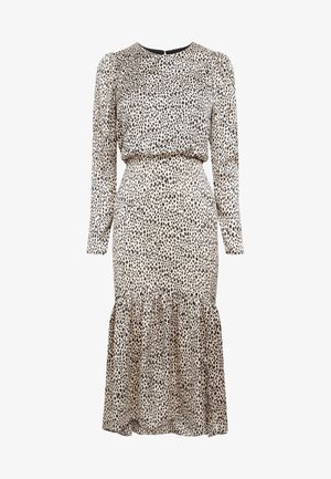 Long-sleeve beige dress with black irregular dots, fitted waist, gathered hem, and round neckline with back button closure.