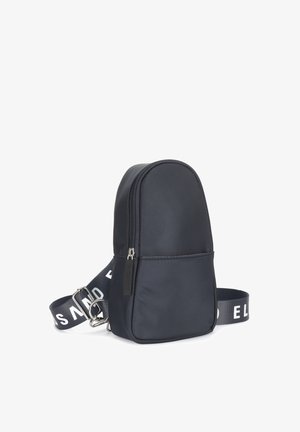 Compact black crossbody bag with front zipper pocket and adjustable strap featuring white branded lettering.