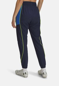 Under Armour CHALLENGER WARMUP - Teplákové kalhoty - washed navy
