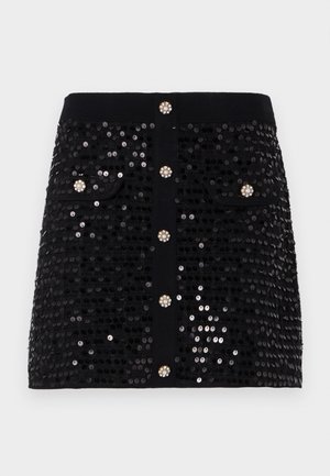 Zwarte paillettenrok met een aansluitend ontwerp, twee frontzakken en decoratieve knopen met juweelachtige accenten. Glad materiaal overal.