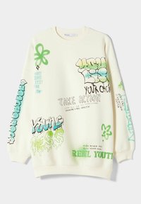 Sudadera color crema con texto y diseños estilo graffiti en verde y azul, de corte holgado y puños acanalados.