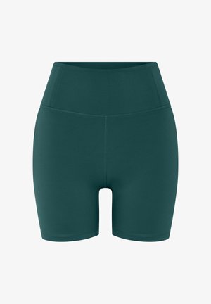 Sötétzöld, magasított derekú sportnadrág lapos varrásokkal, sima, rugalmas anyagból készült, kifejezetten aktív viselethez.