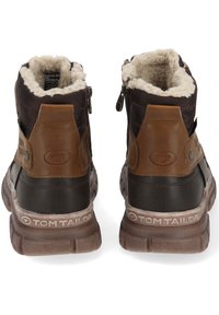 Brown insulated ankle boots featuring a textured fabric upper, leather accents, zip closure, and a rubber outsole with branding.