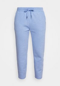 Ljusblå sweatpants i mjukt material, med resårmidja och dragsko, samt avsmalnande ben med ribbad fåll.