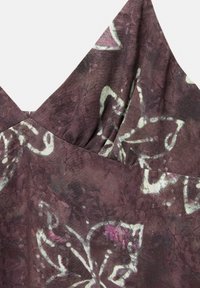 Dark purple fabric with a floral pattern in lighter shades. Features a V-neck design and soft texture, with subtle gathering at the neckline.