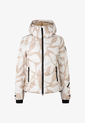 Vatteret dynejakke i beige og hvid med abstrakte mønstre. Har en hætte, lynlås foran og sidelommer med sorte detaljer.