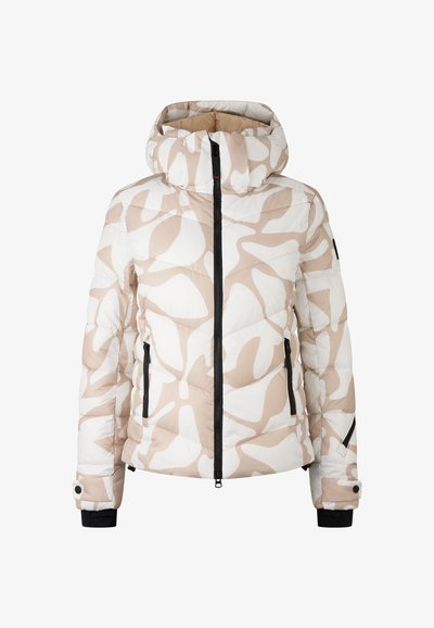 Vatteret dynejakke i beige og hvid med abstrakte mønstre. Har en hætte, lynlås foran og sidelommer med sorte detaljer.