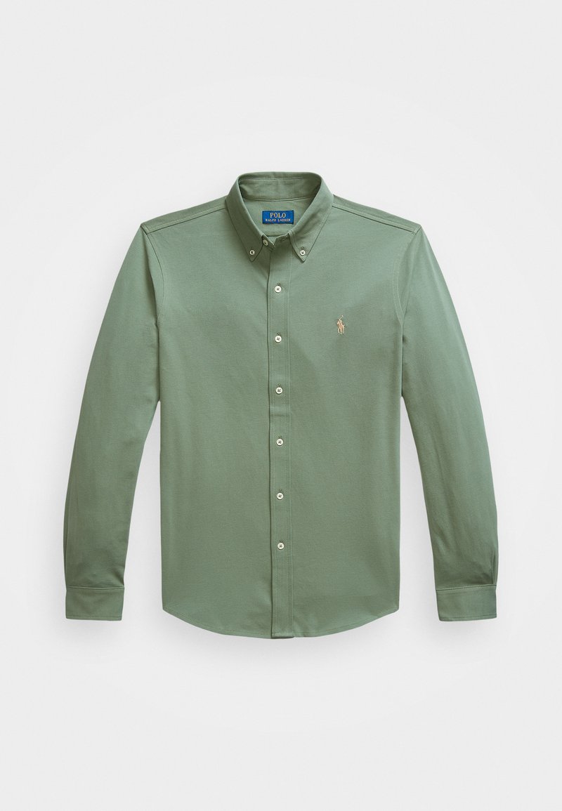 Chemise à manches longues en coton vert olive, avec un col pointu, une patte de boutonnage à l'avant et un petit logo sur la poitrine.