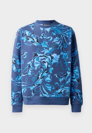 Marinblå sweatshirt med intrikata blå blomster mönster. Har en rundad halslinning och ribbade muddar. Tillverkad av mjukt tyg med en slät yta.