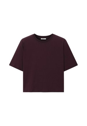 T-shirt court uni violet foncé à manches courtes avec un col rond sur fond blanc.
