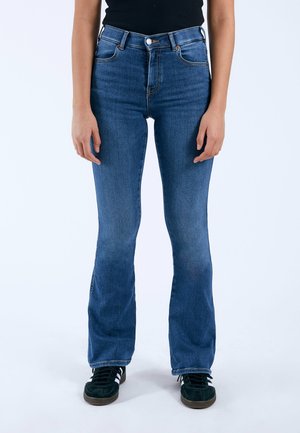 Blue flared jeans made from denim with a mid-rise waist, featuring front pockets, a button closure, and slight fading near the bottom.