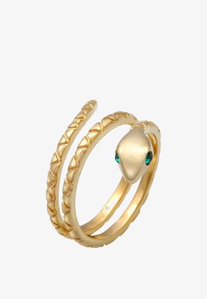 Bague en spirale en or en forme de serpent avec des yeux en pierre précieuse verte et des détails texturés d'écailles le long de l'anneau.