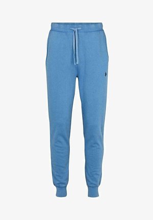 Hellblaue Jogginghosen mit elastischen Bündchen, Zugband in der Taille, Taschen an den Seiten und kleinem besticktem Logo am Oberschenkel.