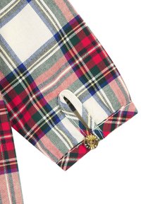 Kariertes Gewebe in Rot, Grün und Blau auf weißem Hintergrund, mit einem Knopf mit "Steiff"-Markenaufdruck und einer Stoffschlaufe zum Befestigen.