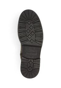 Suela de zapato de goma negra que presenta un patrón de relieve texturizado con surcos y un logo en relieve. Tamaño 42 marcado en el lateral.