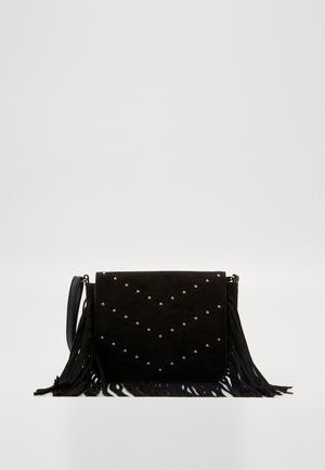 Black suede crossbody bag with fringe detailing, chevron pattern adorned with metallic studs, and a slim strap for carrying.