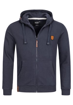 Sudadera con cremallera azul marino hecha de tela suave, con capucha, dos bolsillos frontales y un parche de cuero con el logo en el pecho. Puños y dobladillo acanalados.