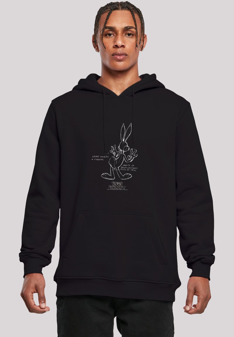 Svart hettegenser med Bugs Bunny-grafikk i hvit kontur, med tekstdetaljer. Avslappet passform, frontlomma og snorhette.