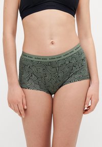 Shorts en mélange de coton vert à motif avec une large ceinture comprenant le logo "BJÖRN BORG", texture lisse et design ajusté.