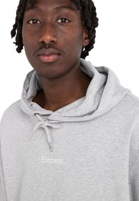 Gray hooded sweatshirt with a drawstring, featuring a small white "Element" logo on the chest. Made of soft fabric with a relaxed fit.