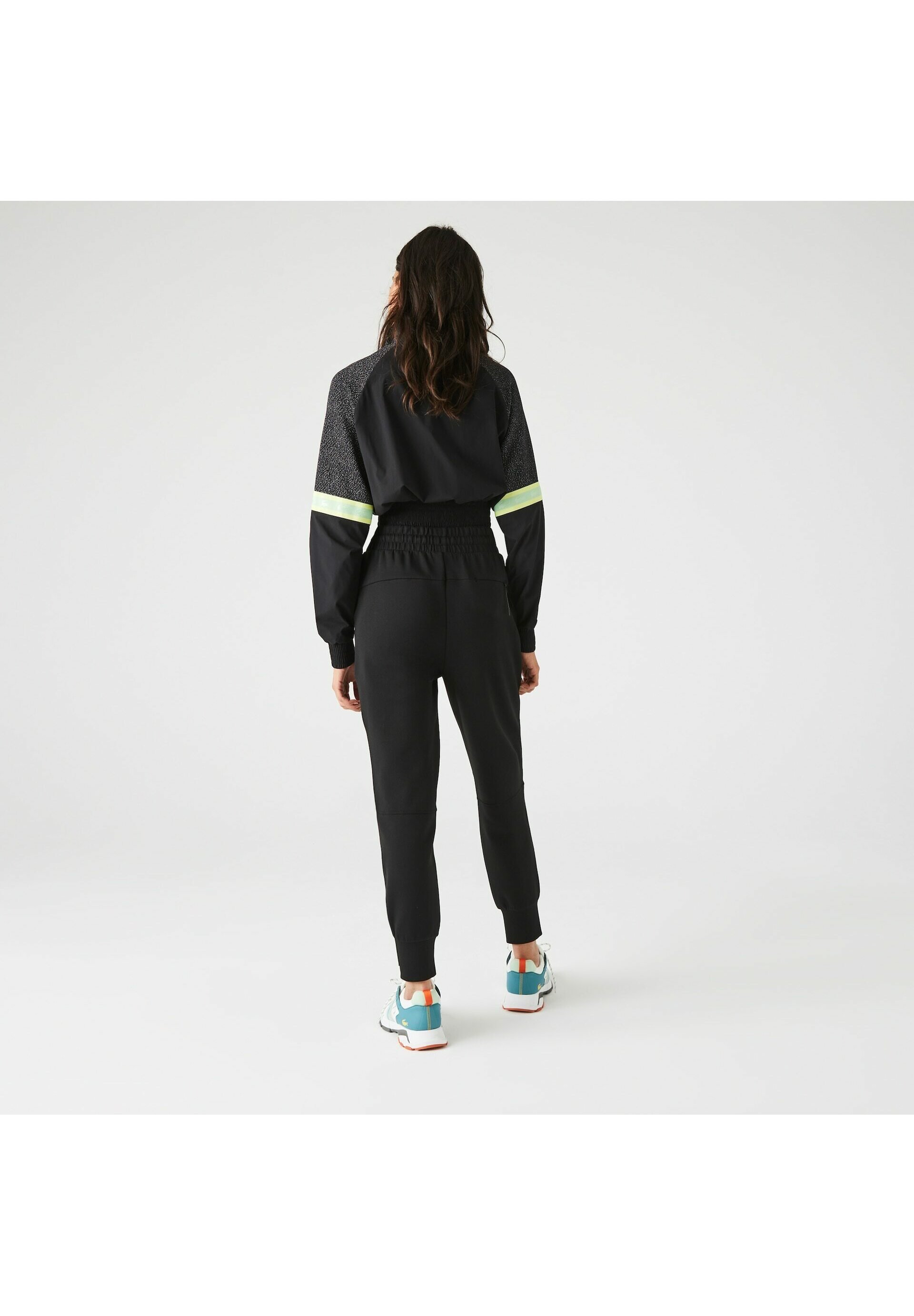 PANTALÓN LACOSTE SPORT CON FRANJA BLANCO