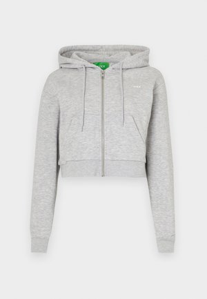 Gray cropped hoodie with a front zipper, drawstring hood, and front pockets. Made of soft fabric with ribbed cuffs and hem.