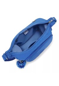 Blue bag with a smooth fabric exterior, zip closure, and a soft interior. Features a blue pom-pom charm. Compact design with an outer pocket.