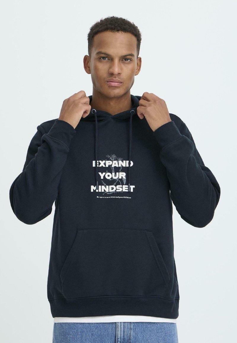 Navy hoodie with a front pocket, featuring a white graphic design that reads "EXPAND YOUR MINDSET" in bold text. Cotton material, relaxed fit.