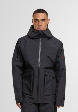 Black waterproof jacket featuring a high collar, front zipper, multiple pockets, adjustable cuffs, and a smooth, durable texture.
