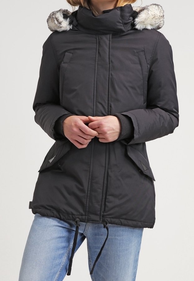Black padded jacket with a fur-lined hood, featuring two front pockets, drawstring waist, and ribbed cuffs. Smooth texture and practical design.