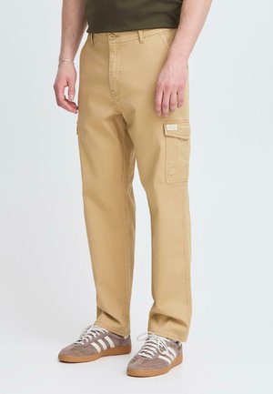 Beige cargo pants with a straight fit, two side pockets, and a patch pocket on the thigh. Made from durable cotton fabric.