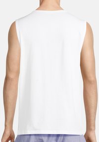 White sleeveless t-shirt featuring a round neckline and a smooth cotton texture, seen from the back, revealing clean stitching and a relaxed fit.