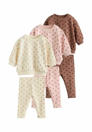 Three toddler sets of long-sleeve tops and leggings, each with polka dot patterns in cream, pink, and brown colors.