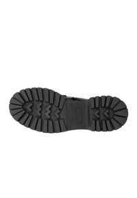 Suola di stivale in gomma nera con superficie texture, caratterizzata da profonde scanalature e motivi a zigzag per una buona aderenza. Design piatto e ampio.