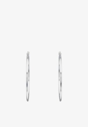 Boucles d'oreilles fines en argent avec fermoirs à charnière, vues de profil sur un fond blanc.