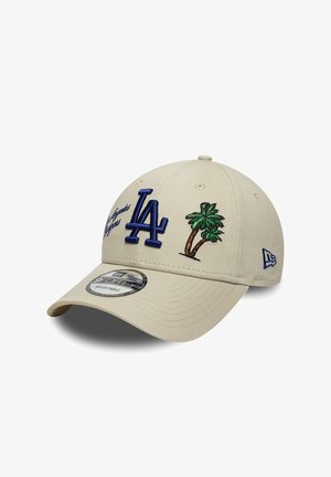 Beige adjustable cap with blue "LA" logo, green and brown palm tree embroidery, and small text on front left side.