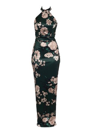 Green floral-printed maxi dress with a halter neck design. Made of a smooth fabric, featuring beige flowers and dark green accents.