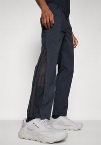 Columbia WANOGA™ PRO VENT PANT - Hlače za otvoreno - black