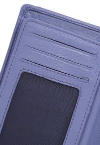 Purple leather wallet featuring card slots, a transparent ID slot, and textured dark fabric backing. Rounded corners and stitched edges.